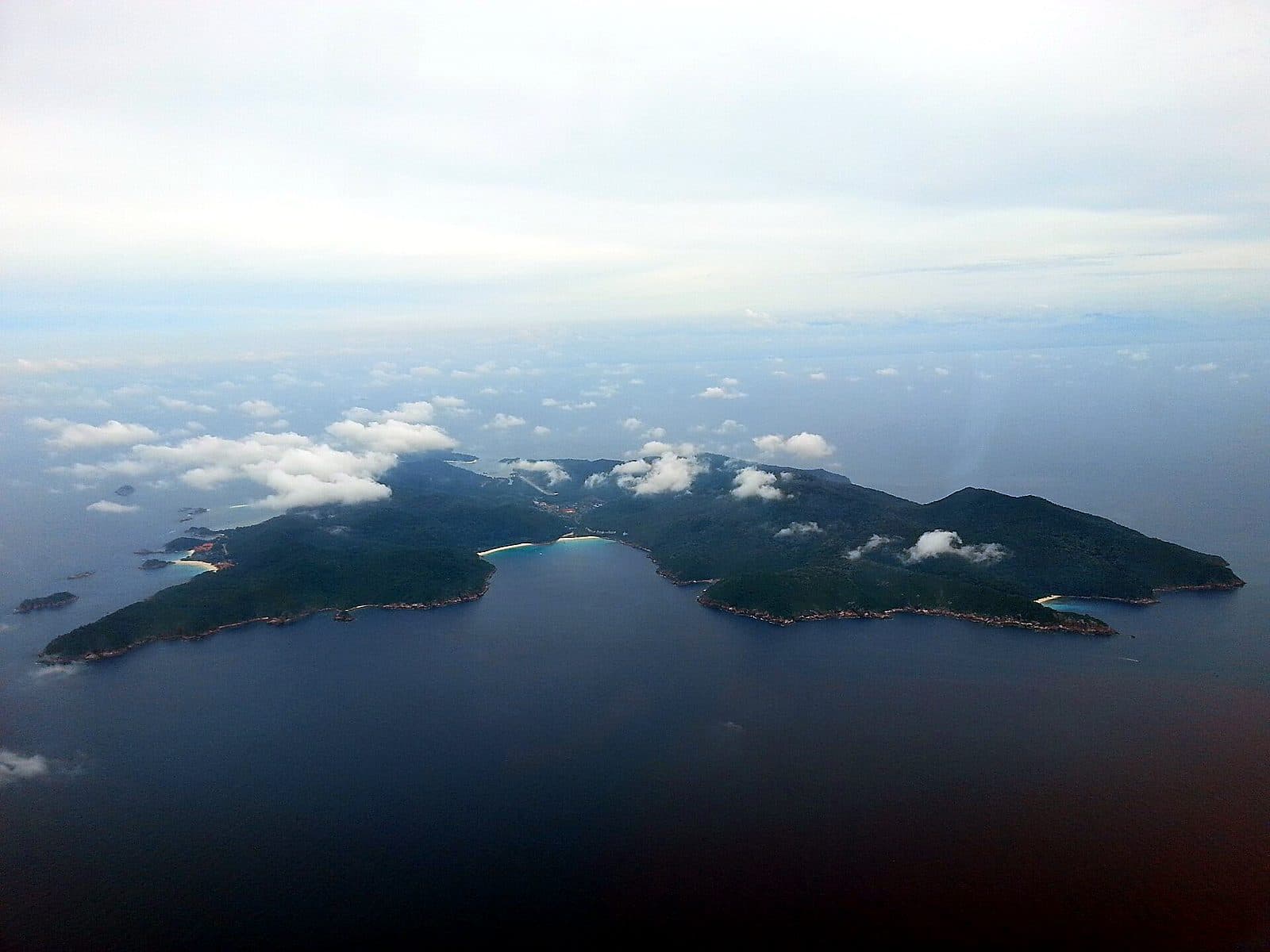 Pulau Redang from the air — the marine-park island and its bays ringed by deep blue sea