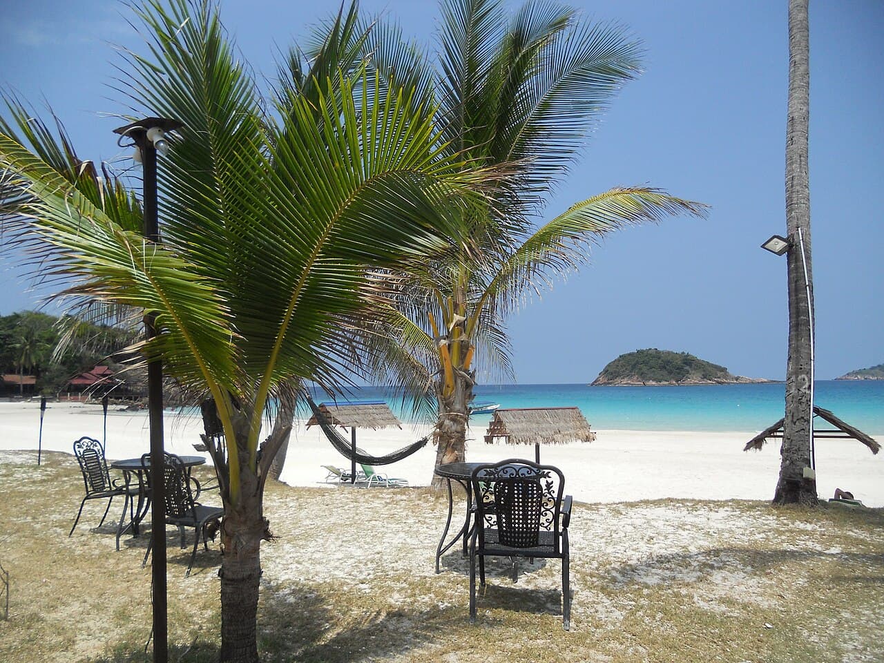 A quiet island bay in the Pulau Redang group, the kind reached on a boat day-trip